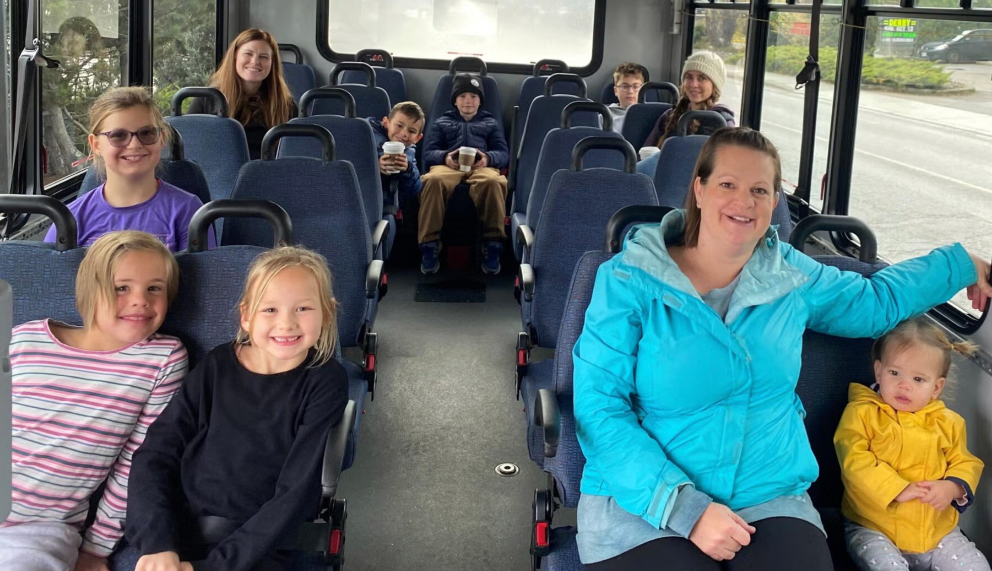 Image of moms and kids on bus