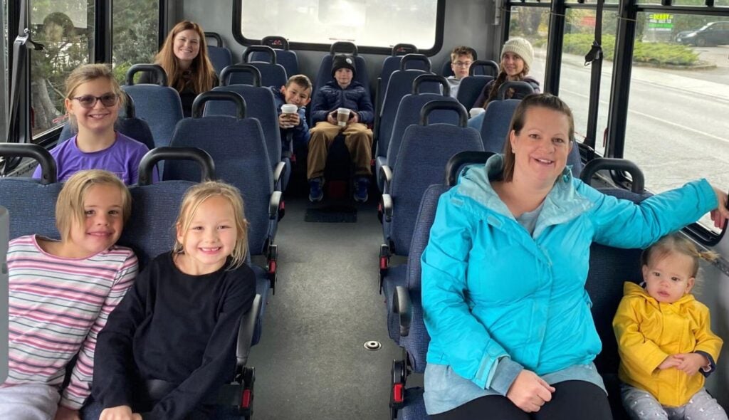 Image of moms and kids on bus