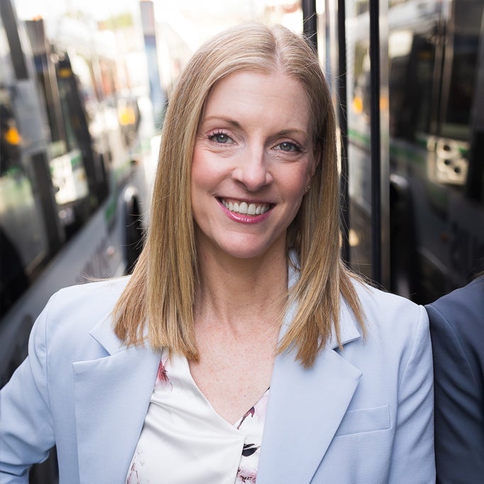 A medium shot of BC Transit's CEO Erinn Pinkerton, sitting in a transit bus.