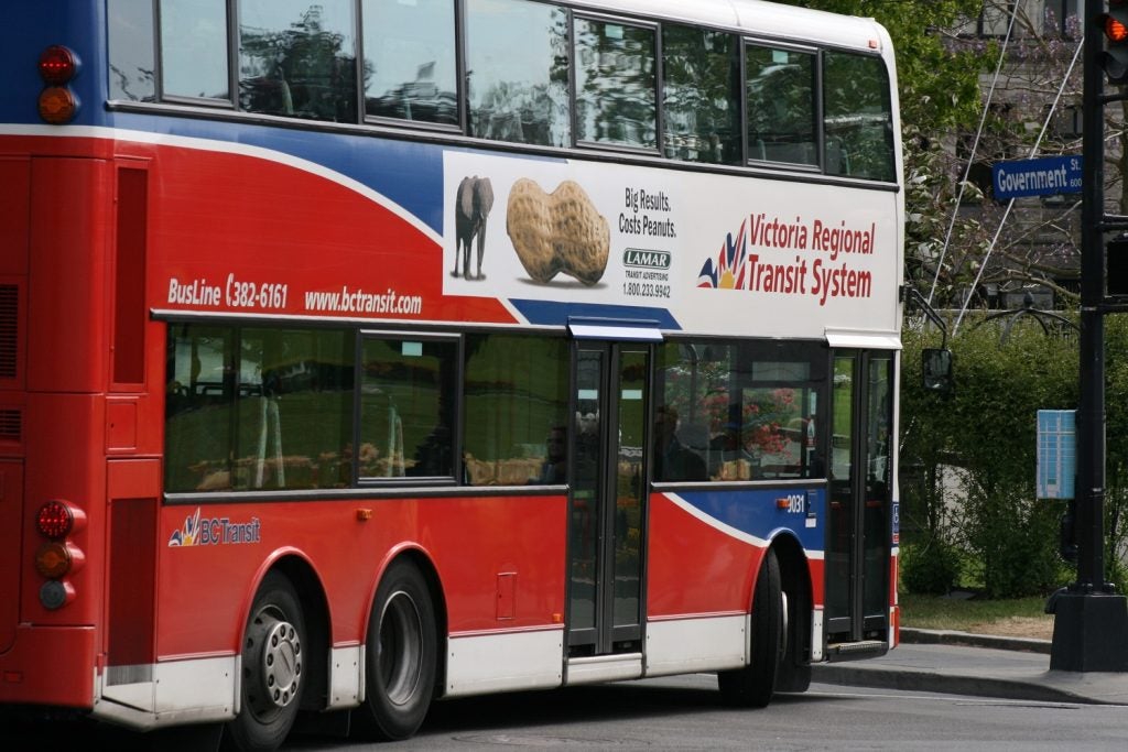 A double decker bus in BC Transit's old blue and red livery.